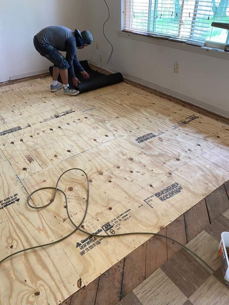 Floor joist and structural home repair work with floor installation then carpet installation