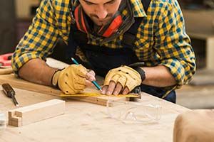 Carpenter performing home repair and remodeling services