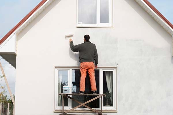 Exterior painting services including fence painting and deck refinishing
