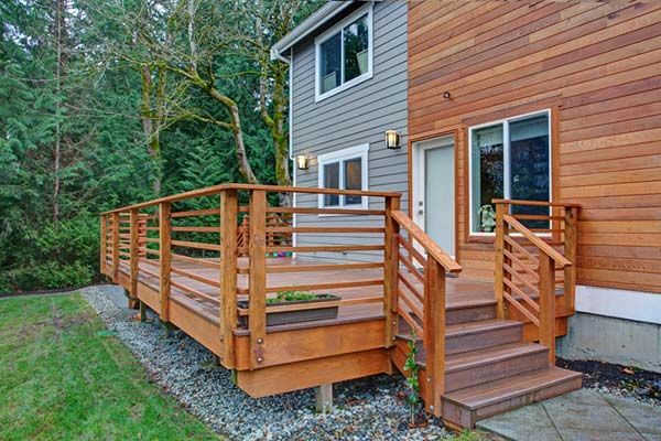 Attached deck with deck refinishing by JT's Home Repair