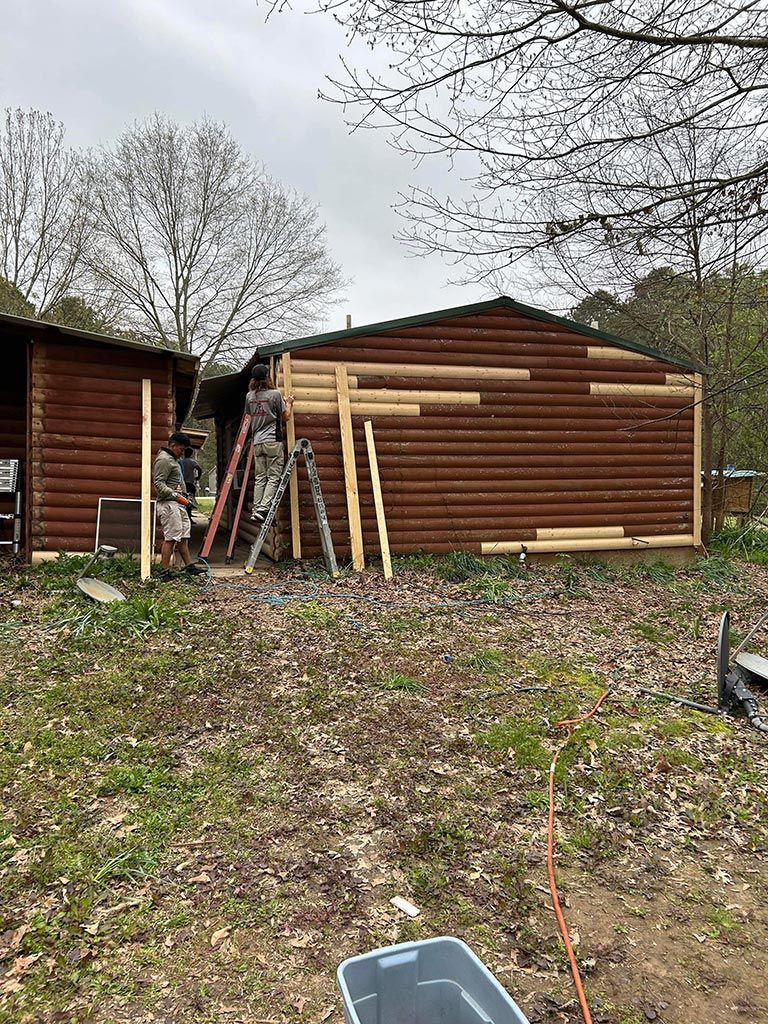 Log house home repair and restoration project with fence installation