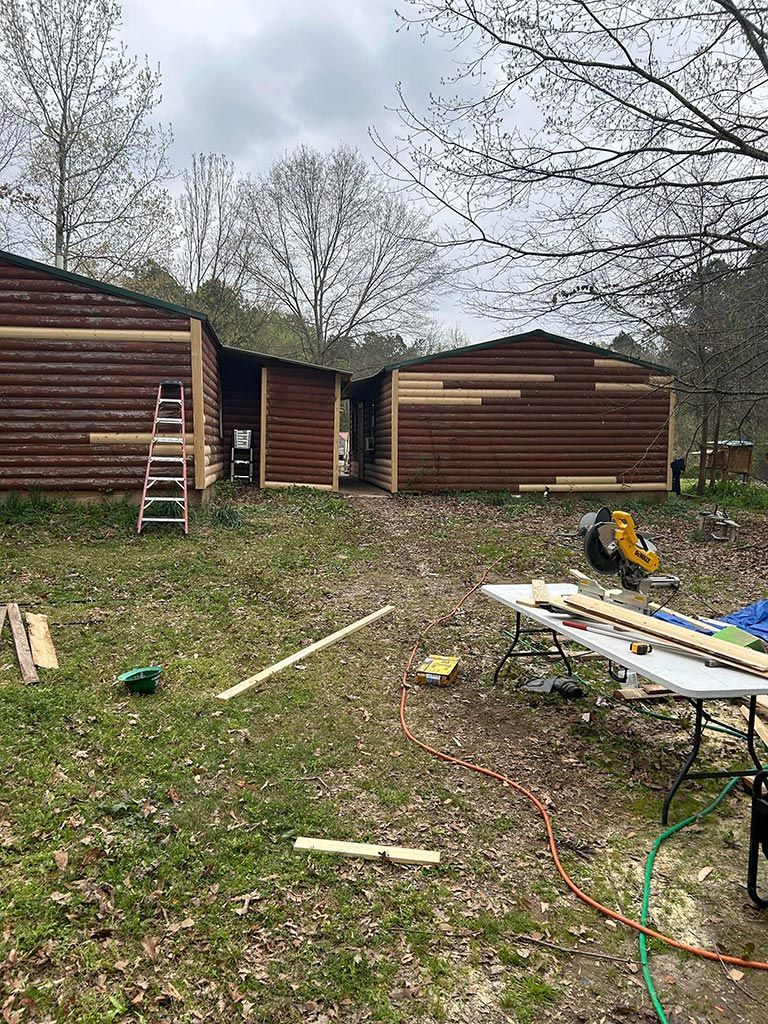 Log house home repair and restoration project with fence installation