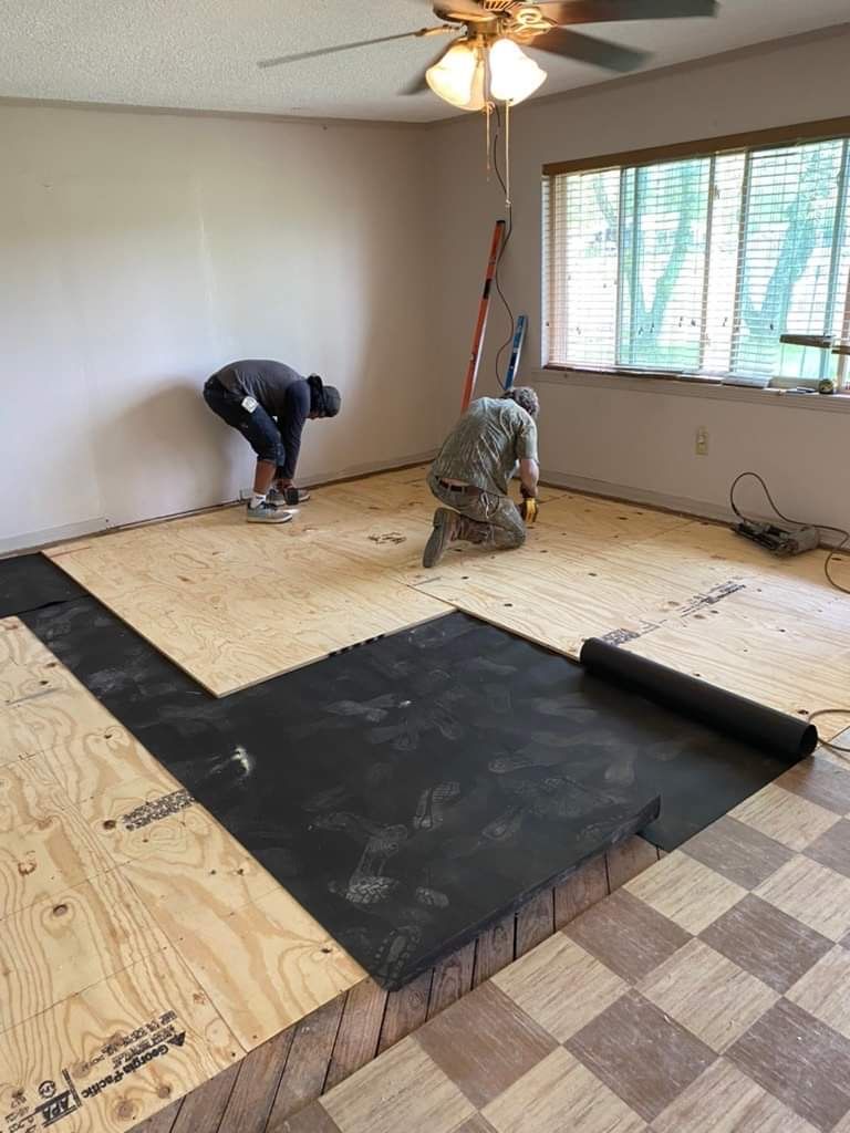 Floor joist and structural home repair work with floor installation then carpet installation